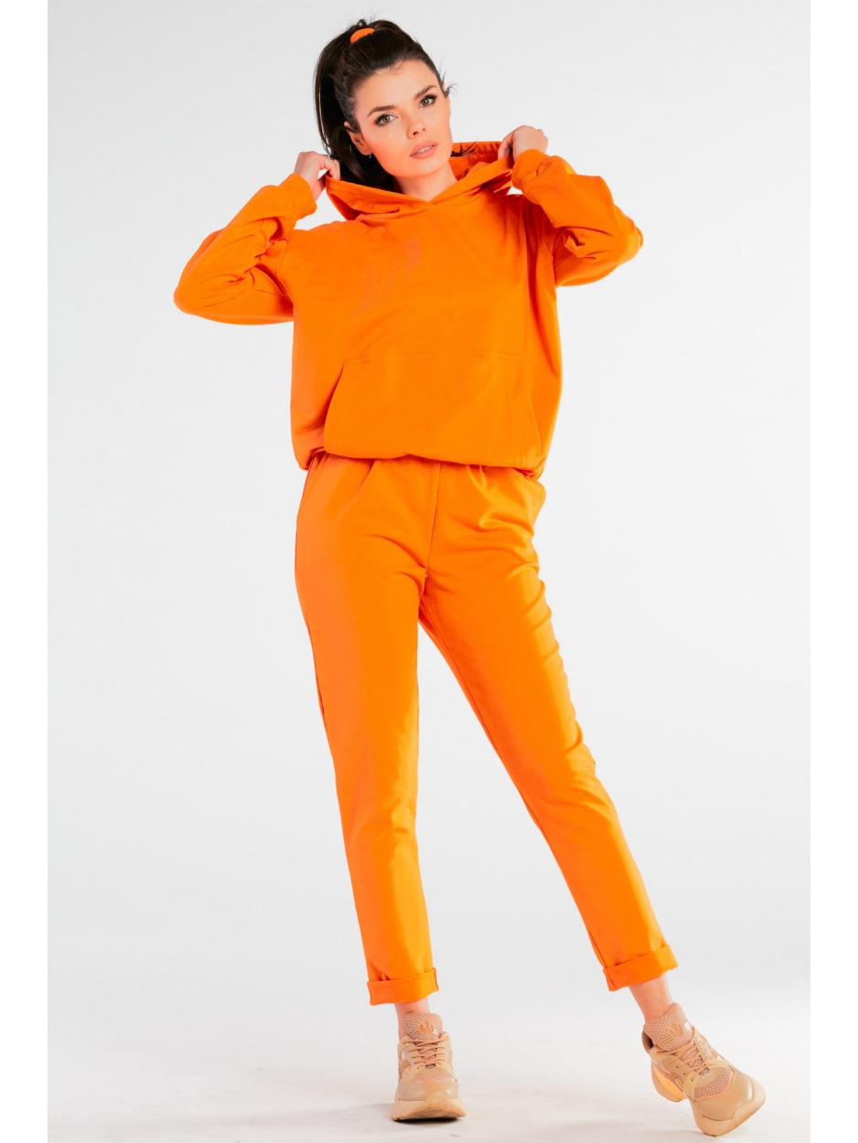 Spodnie dresowe bawełniane z kieszeniami, pomarańczowe - bok