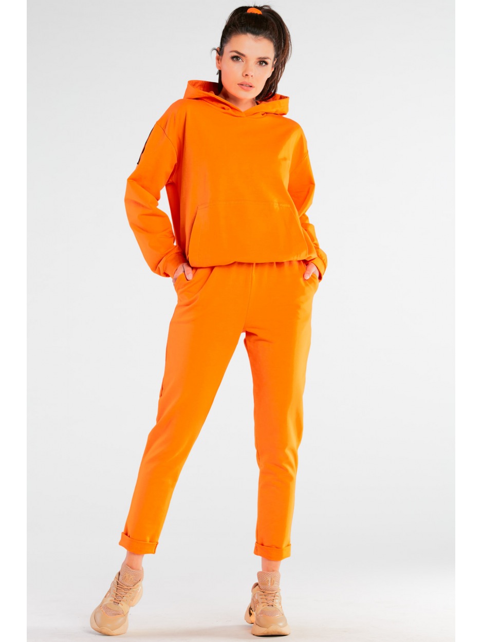 Spodnie dresowe bawełniane z kieszeniami, pomarańczowe - lewo