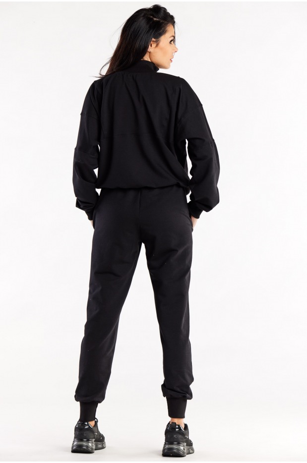 Spodnie dresowe damskie zwężane z przeszyciami, czarne - bok